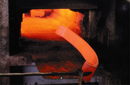 Spring steel being heat treated in our gas furnace